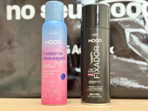 Fixador de Maquiagem MOOD e Hair Spray Fixador preto lado a lado, embalagens modernas e foco em longa duração.