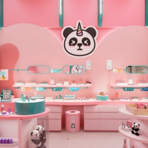 Loja física da Vizzela no Mogi Shopping, com ambiente colorido em tons de rosa e verde, expositores interativos e produtos de maquiagem organizados nas prateleiras.